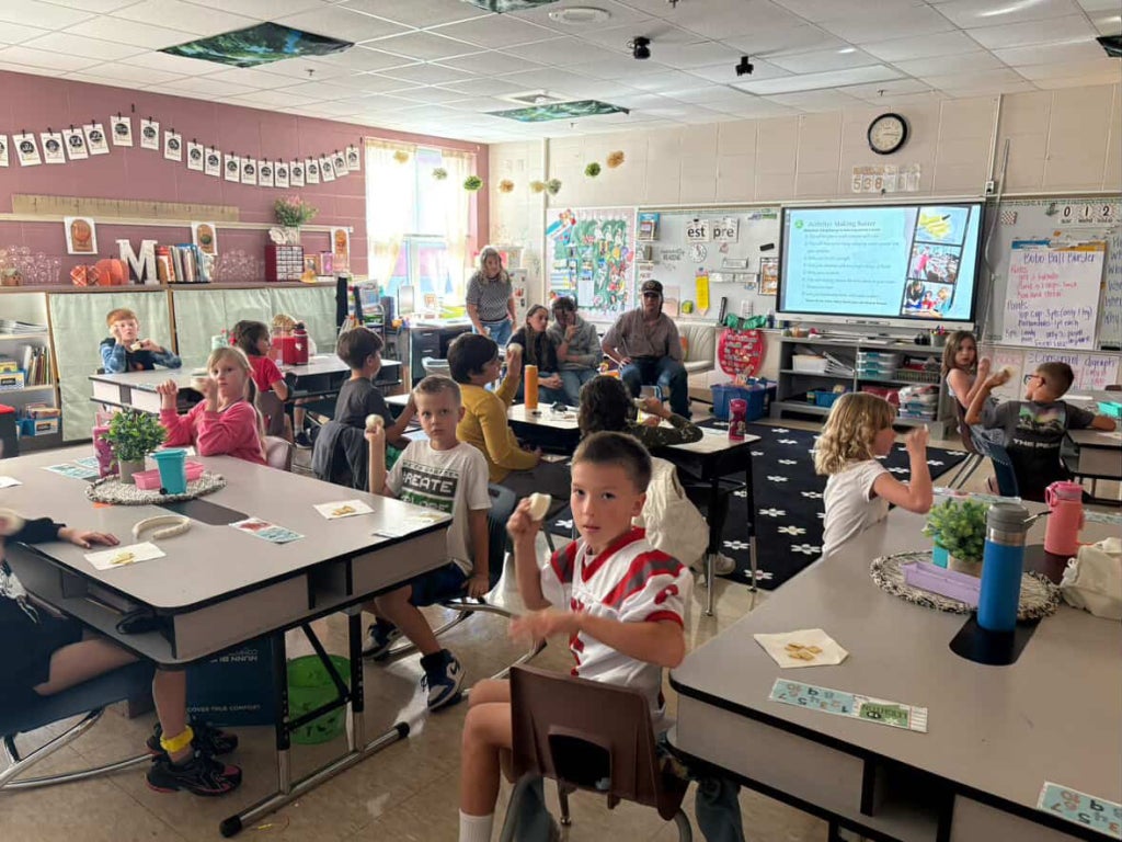 Students make butter as an activity for a lesson on dairy.