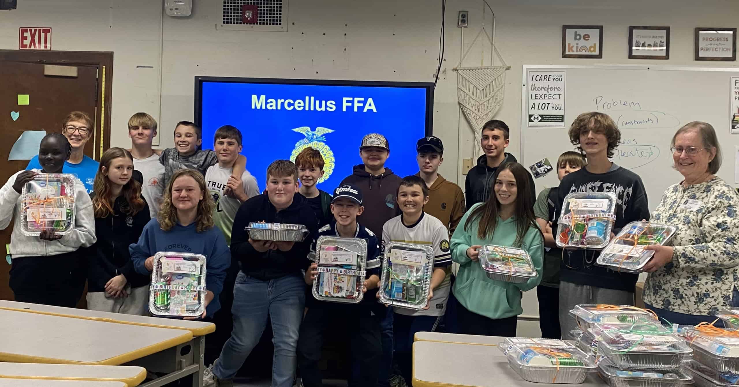 Marcellus FFA members and local Grange partners with birthday kits.