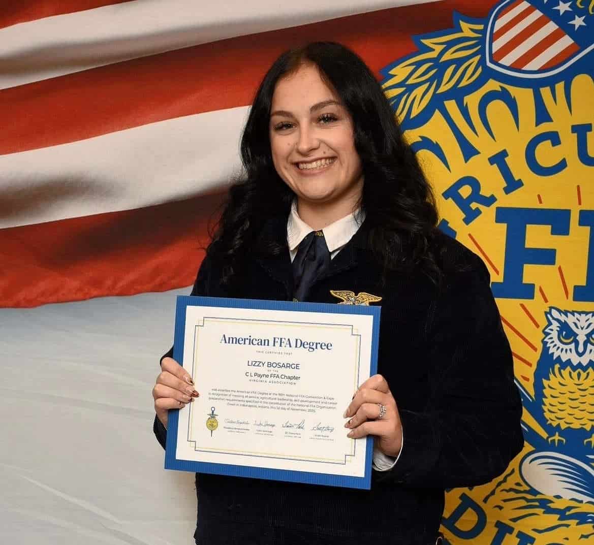 Lizzy Bosarge holds her American FFA Degree at the 98th National FFA Convention & Expo.