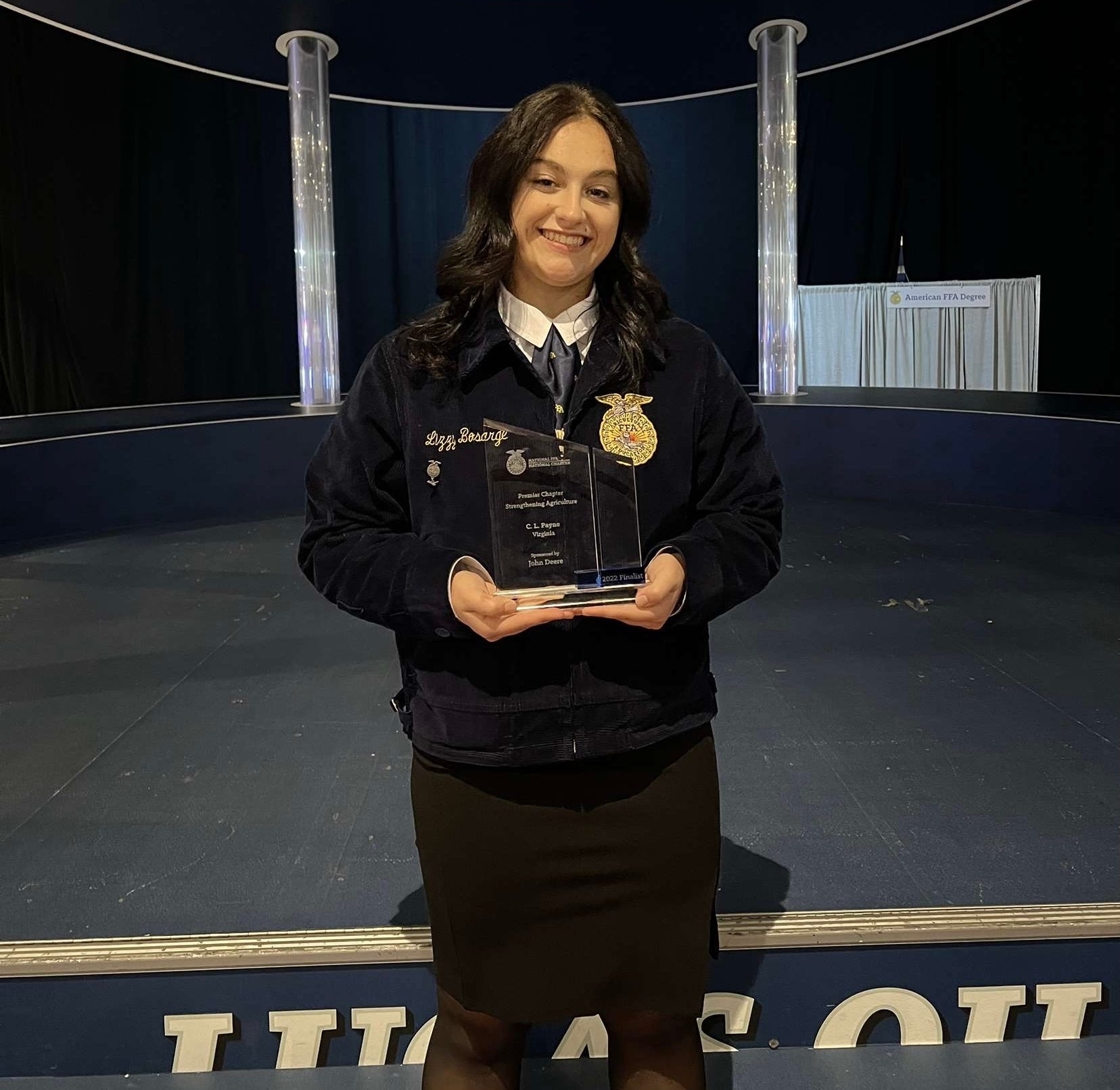 Lizzy Bosarge holds the 2022 Premier Chapter: Strengthening Agriculture award for the C. L. Payne FFA Chapter.