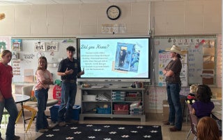 Member Kayden Brewer teaching elementary students about Beef.