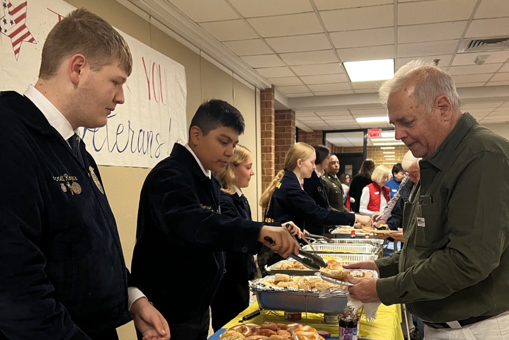 Turner Ashby FFA members serve breakfast to veterans at their annual Veterans Day Celebration.
