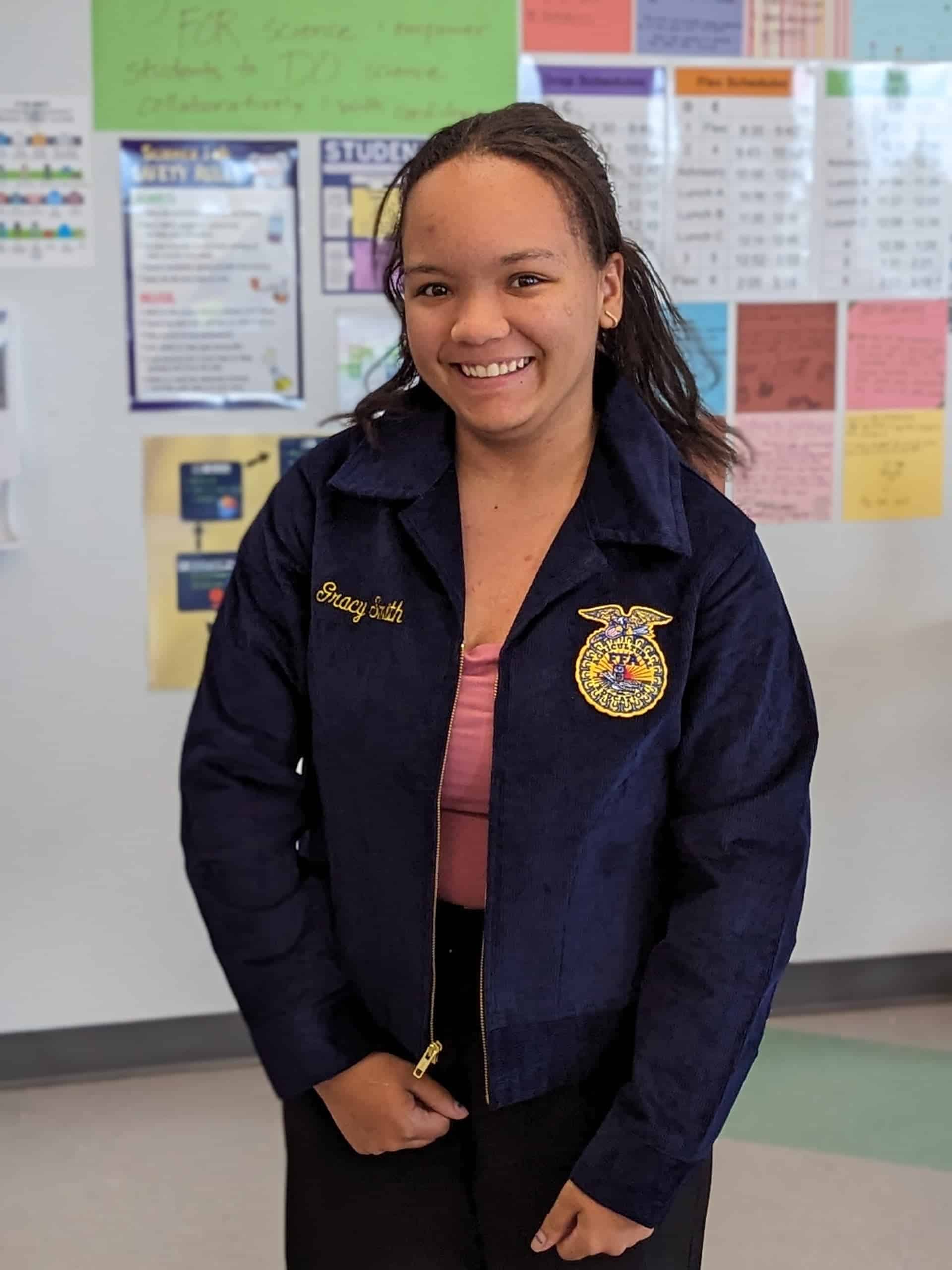 Gracy Smith puts on her FFA blue jacket for the first time in 2023.