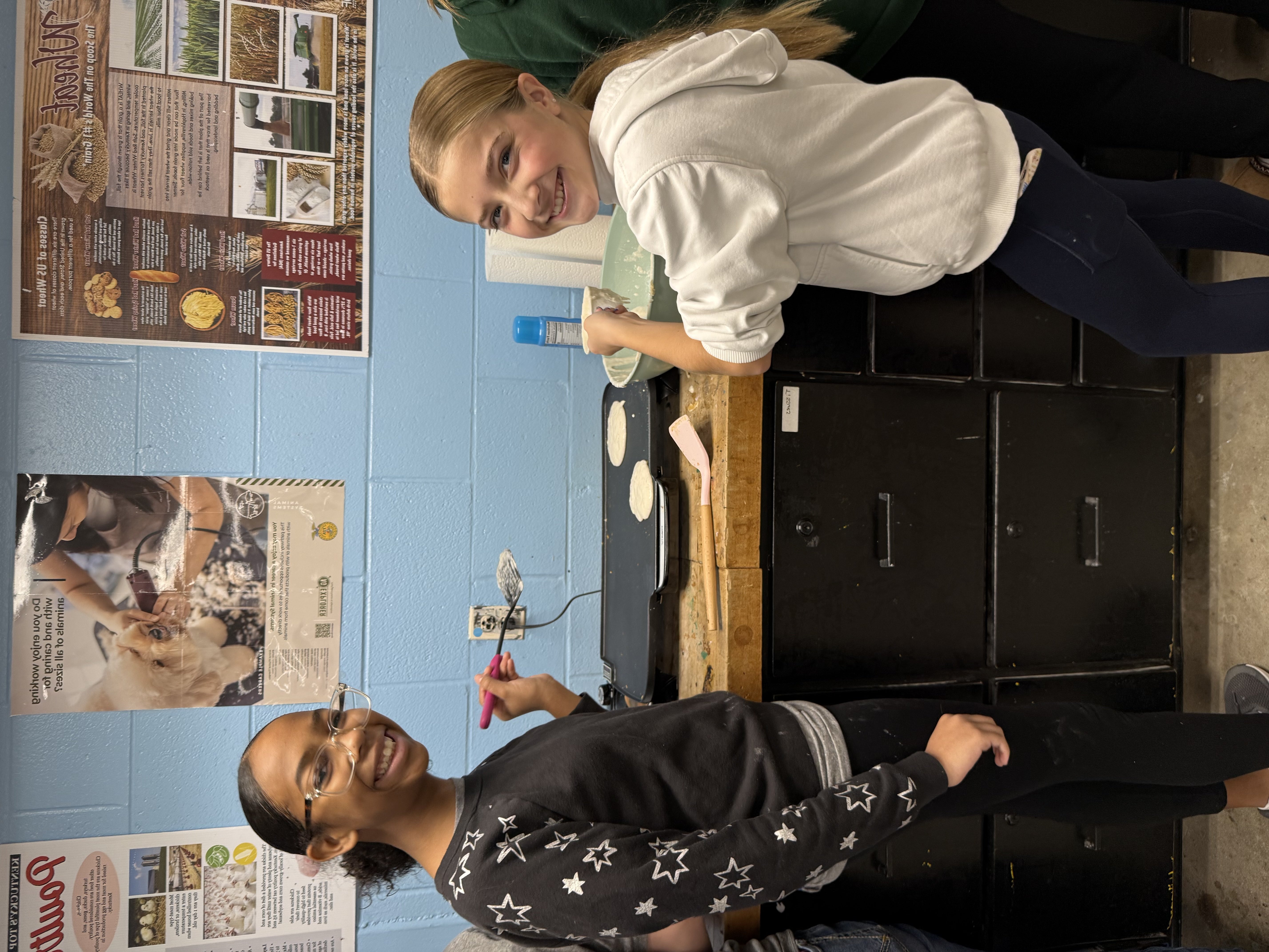 FFA members Piper Fell and DiDi Dickinson prepare the “Thankful for You” breakfast.
