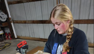 Henning skinning her animal to prepare for mounting