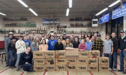Sapulpa FFA gathered around completed Thanksgiving boxes.