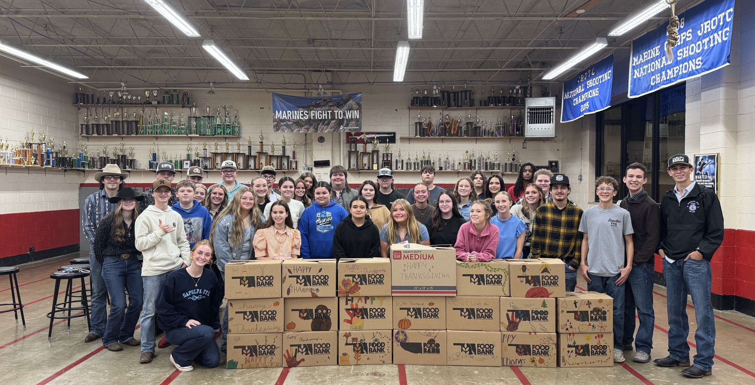 Sapulpa FFA gathered around completed Thanksgiving boxes.