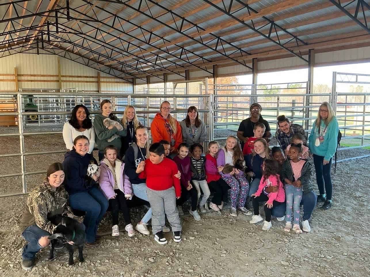 La Crosse Elementary School students meet livestock in the Mecklenburg High School barn.