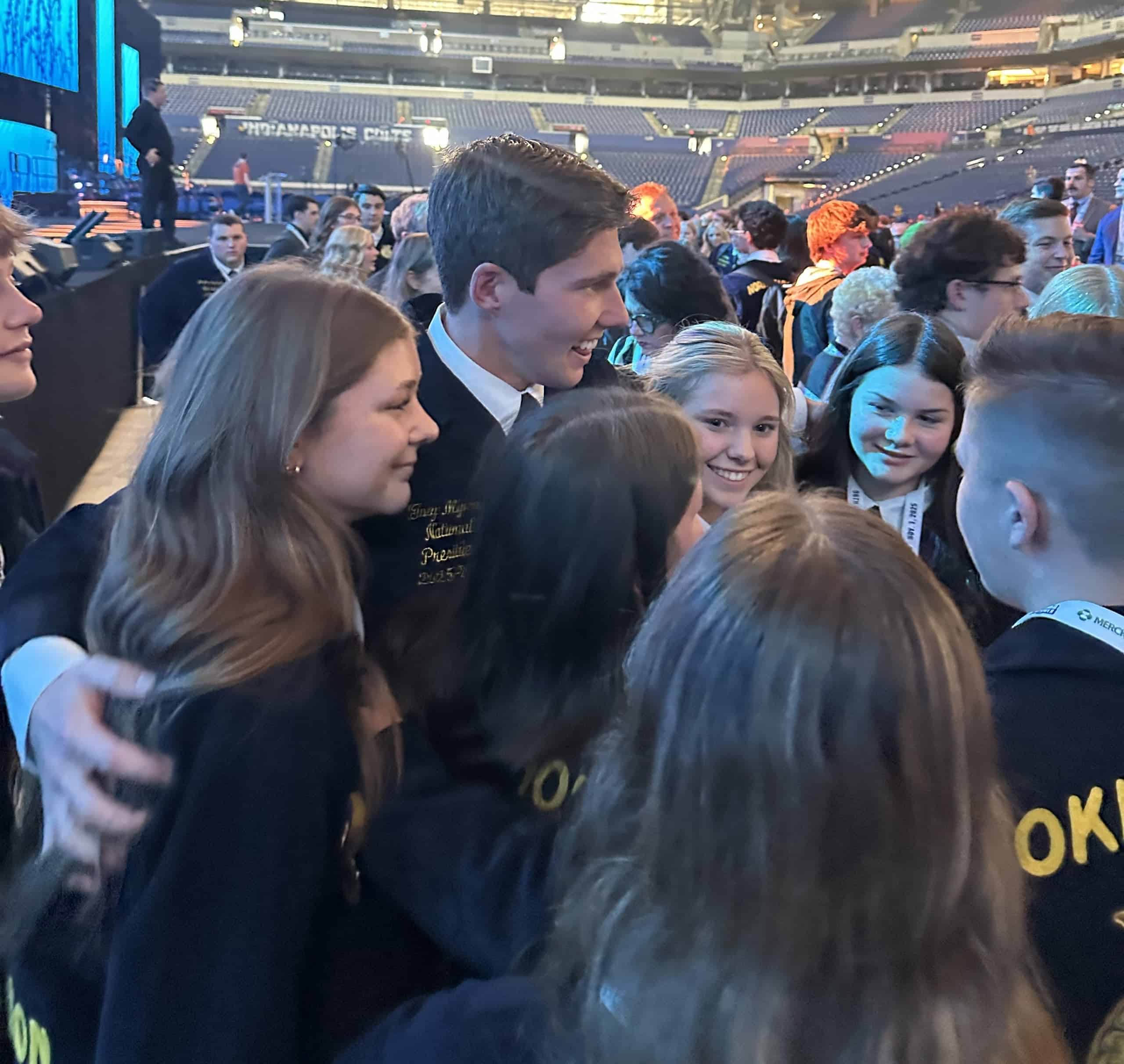 Perkins-Tryon FFA members hug Myers right after he got off of the national stage.