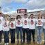Virginia FFA State Officers Danika Landreth, Kylie Bailey, Emma Alexander, Lee Kent, Franco Abud, Georgia Grady, and Alli Phillips along with Mr. Andy Seibel wearing their FFA Game Day shirts.