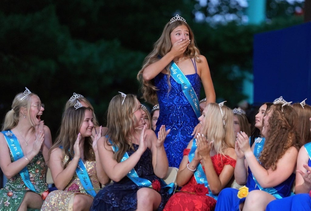 Riah Schrage in shock as she is announced to be the 2025-26 Iowa State Fair Queen.