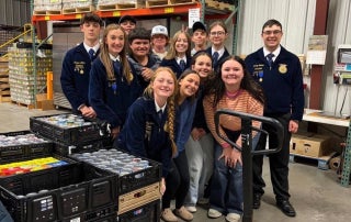 Cheyenne Frontier FFA members pose at the St. Joseph's Food Pantry with some of the items they collected.
