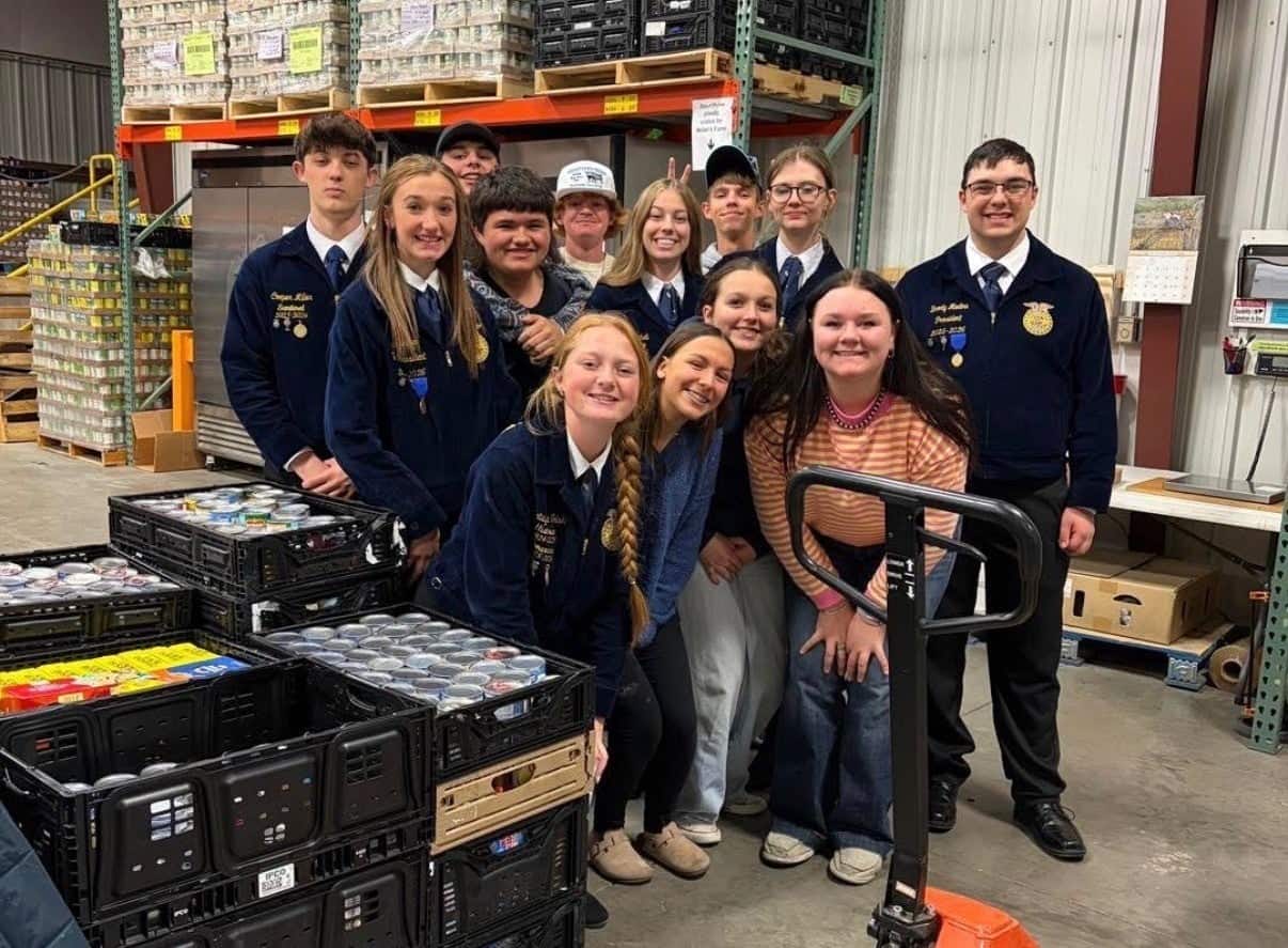 Cheyenne Frontier FFA members pose at St. Joseph’s Food Pantry with some of the items they collected.
