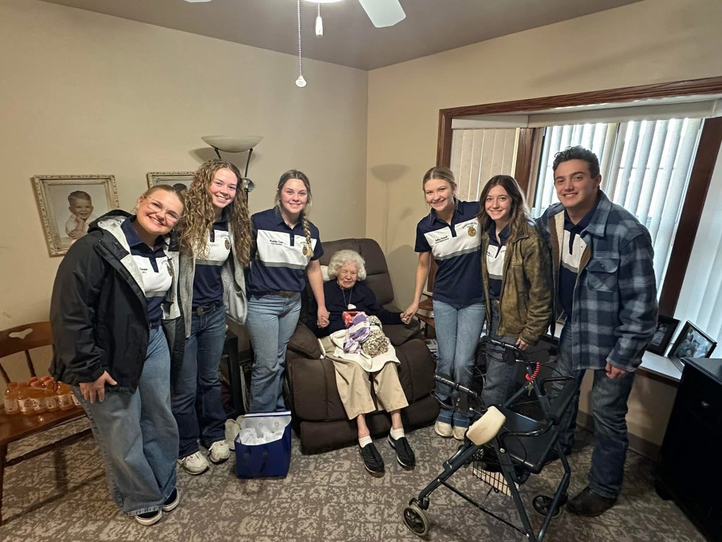 Spreading holiday cheer through giving gifts.