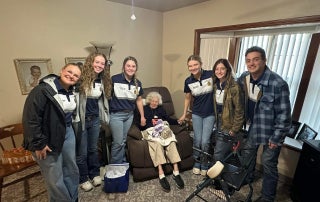 Spreading holiday cheer through giving gifts.