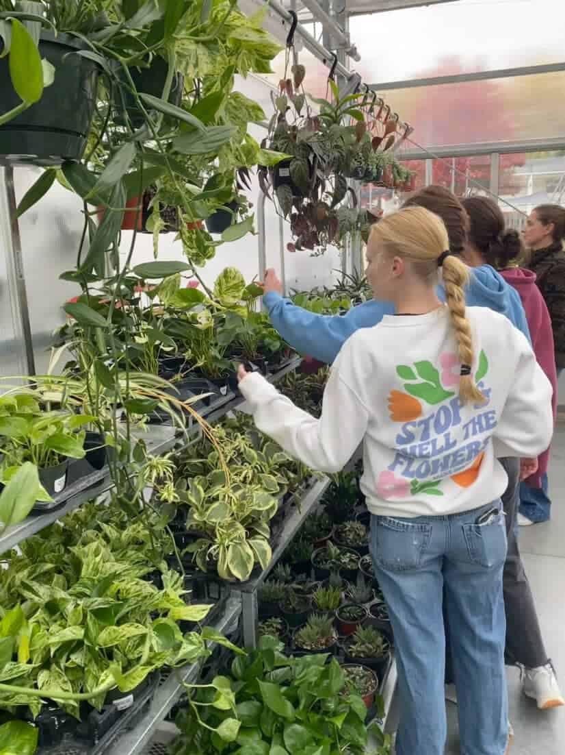 In preparation for the National FFA competition, the girls practice plant identification in a local nursery.