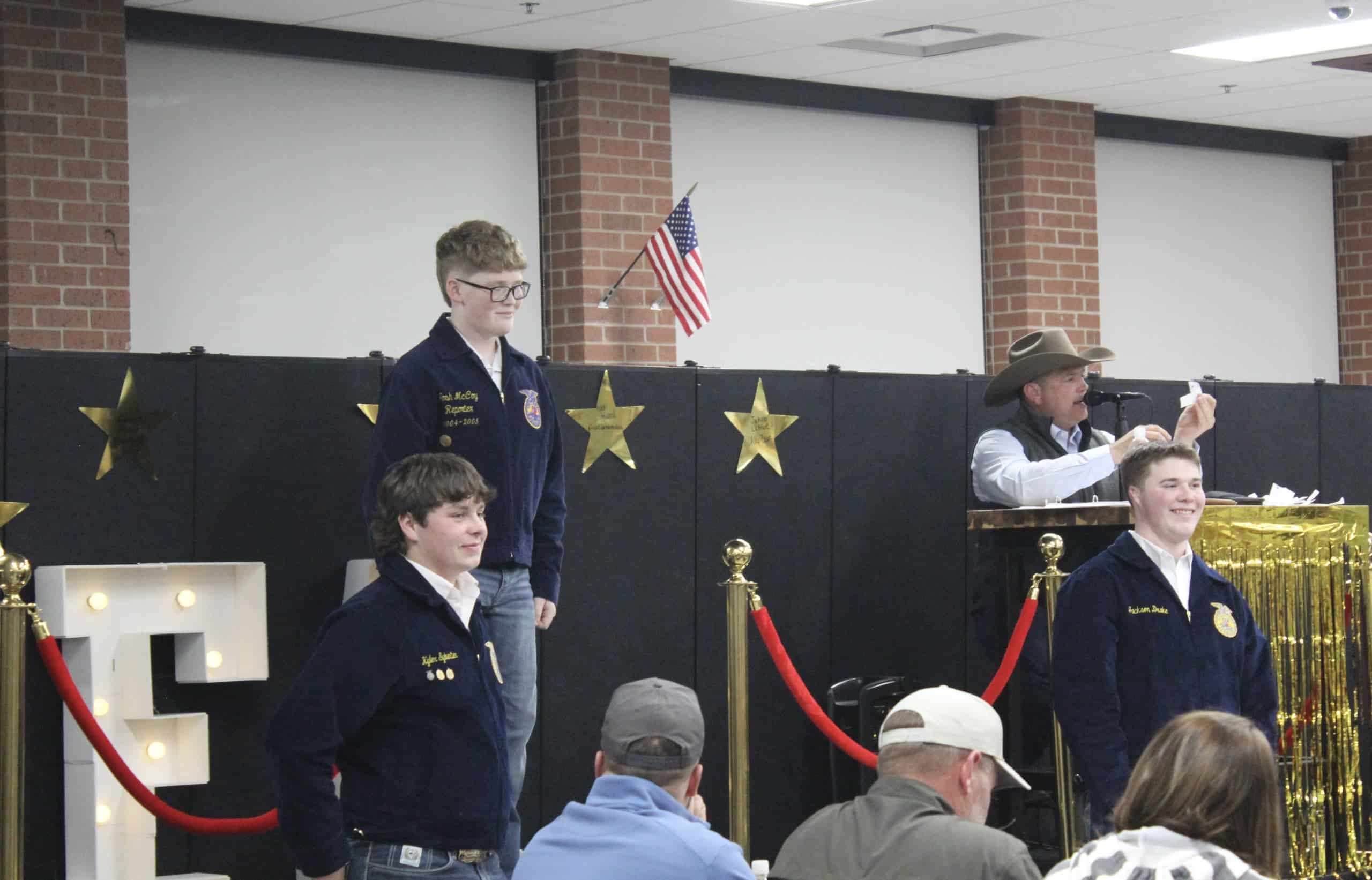Cashion FFA member and eighth grader Eli Hoesli as he’s bid on during the chapter’s annual Work Day Auction.