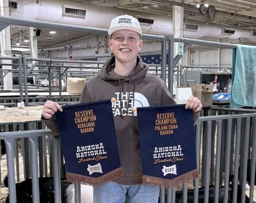 Brock Hammock with his Reserve Champion banners at the Arizona National Livestock Show.