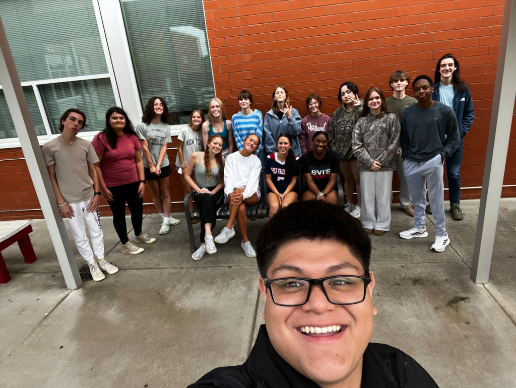 Kevin Manzanarez with one of his Animal Science classes outside Apex Friendship High School during student teaching.