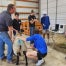 Sutherlin FFA members ultrasound a ewe.