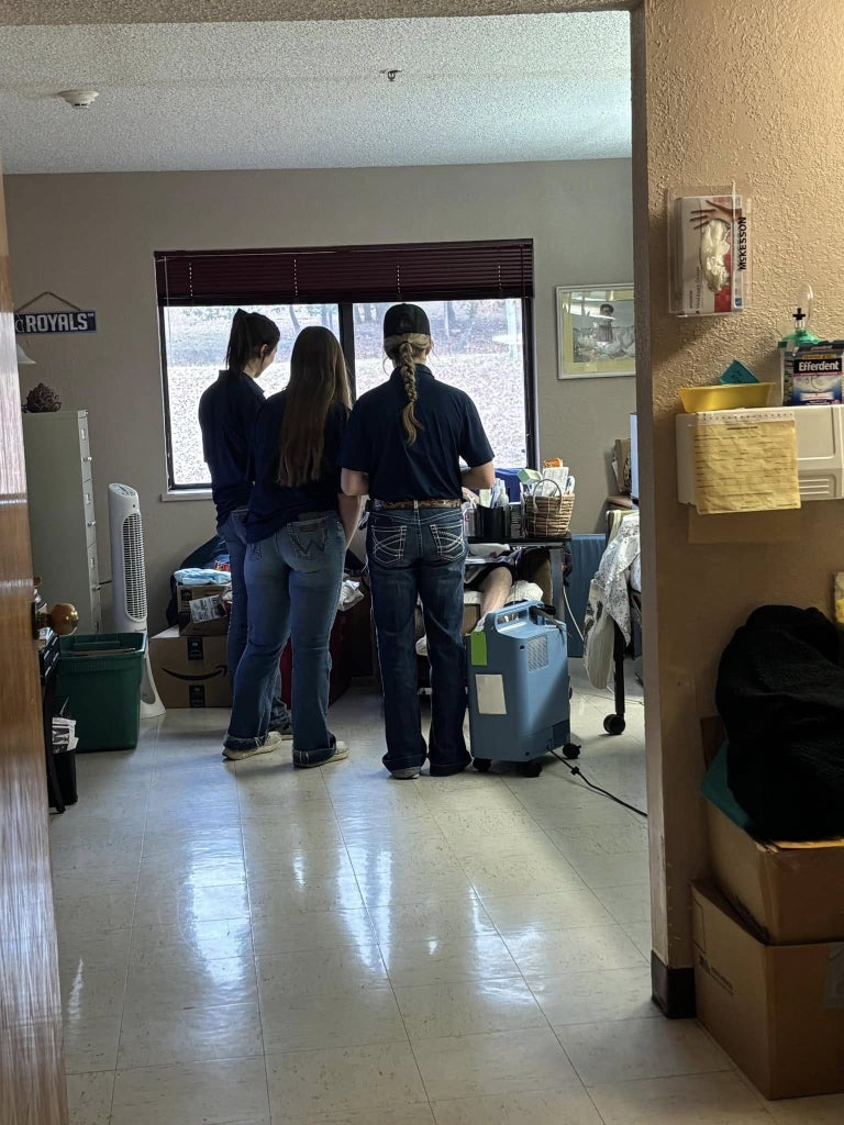 Bailey Harden (left), Rylee Nichols (middle) and Ellah Chesik (right) talk to a resident.