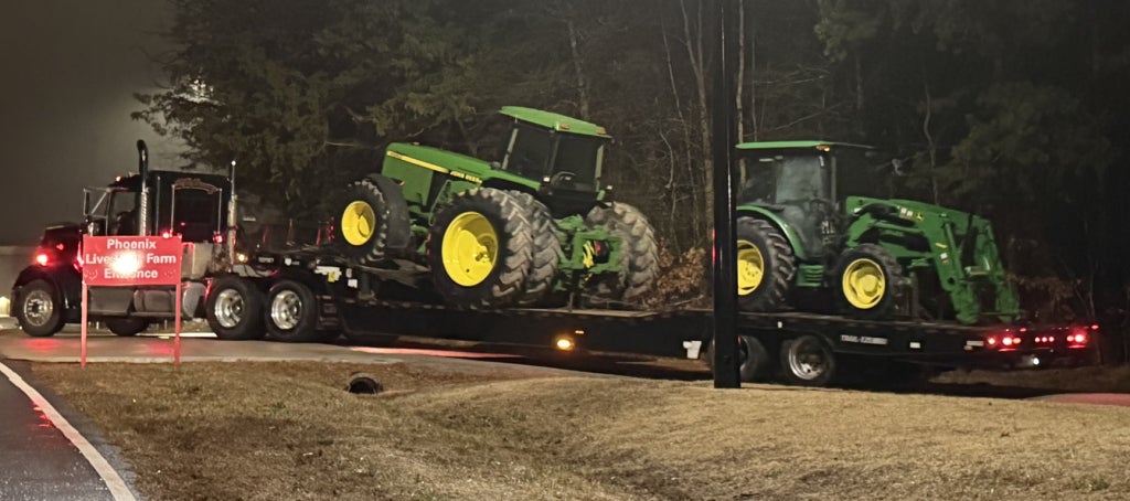 Semi-trailer trucks were used to transport large tractors.