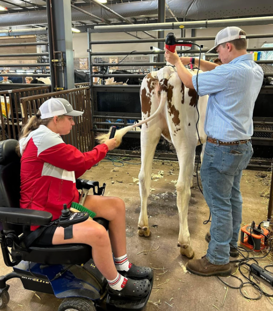 Sydni and Sam Mell working in their barn.