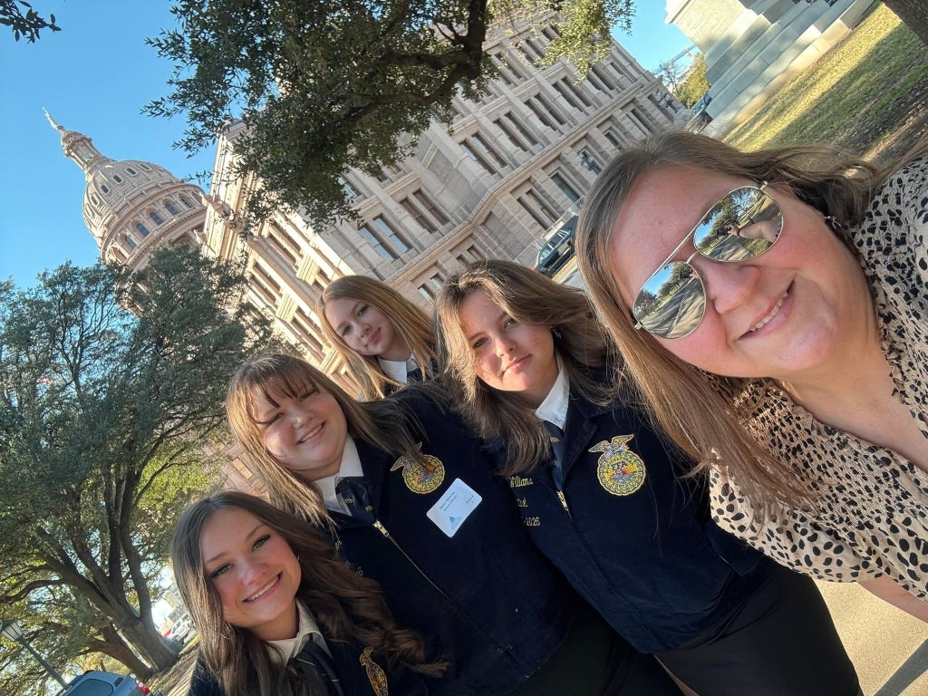 West Hardin FFA officers and their trip sponsor enjoy Austin.