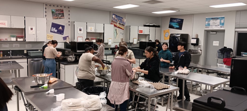 FFA members prepare breakfast for the Teacher Appreciation Breakfast.