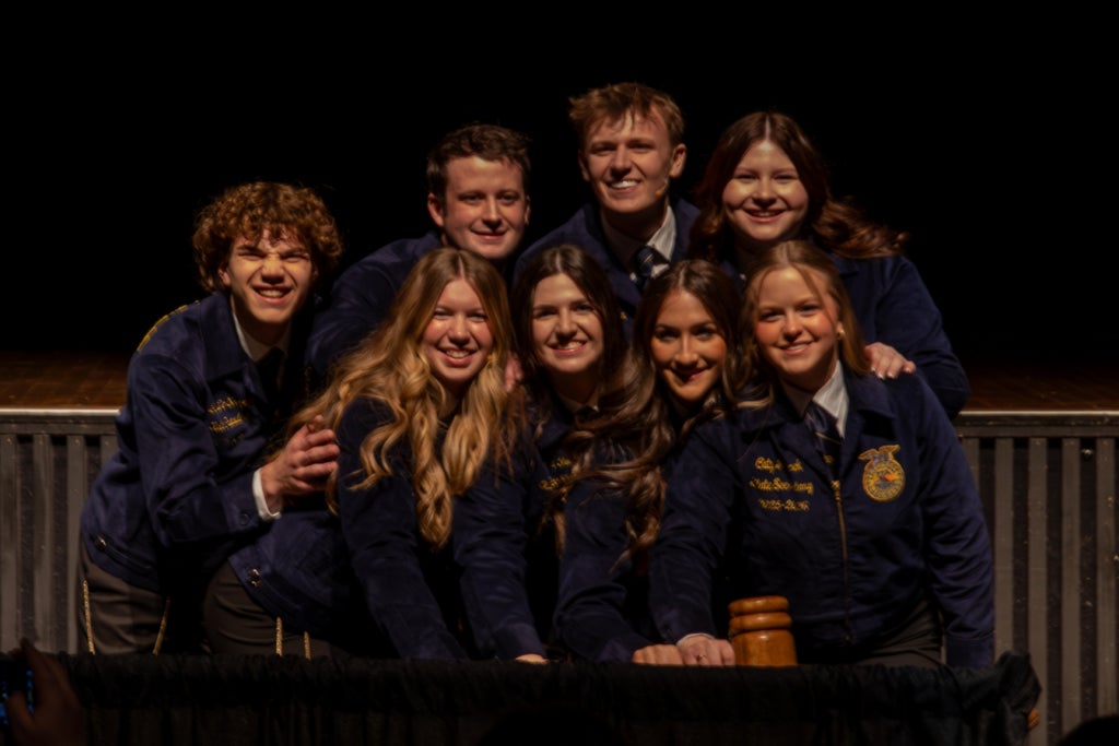 The 2025-2026 Michigan FFA State Officer Team opening the first session of the 98th Michigan FFA State Convention. Top row (left to right): State President Brent DeSaegher, State Vice President William Rogers, State Treasurer Andersen Zachar and State Vice President At-Large Lizzie Hartmann. Bottom row (right to left): State Sentinel Carly VanderRoest, State Vice President At-Large Keira Fudge, State Reporter Jessica Peters and State Secretary Caty Janicek.