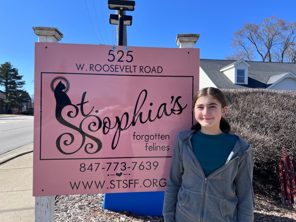Cadence Christenson in front of one of her local animal shelters, after she delivered supplies to the shelter as a part of her non-profit, AniMend.