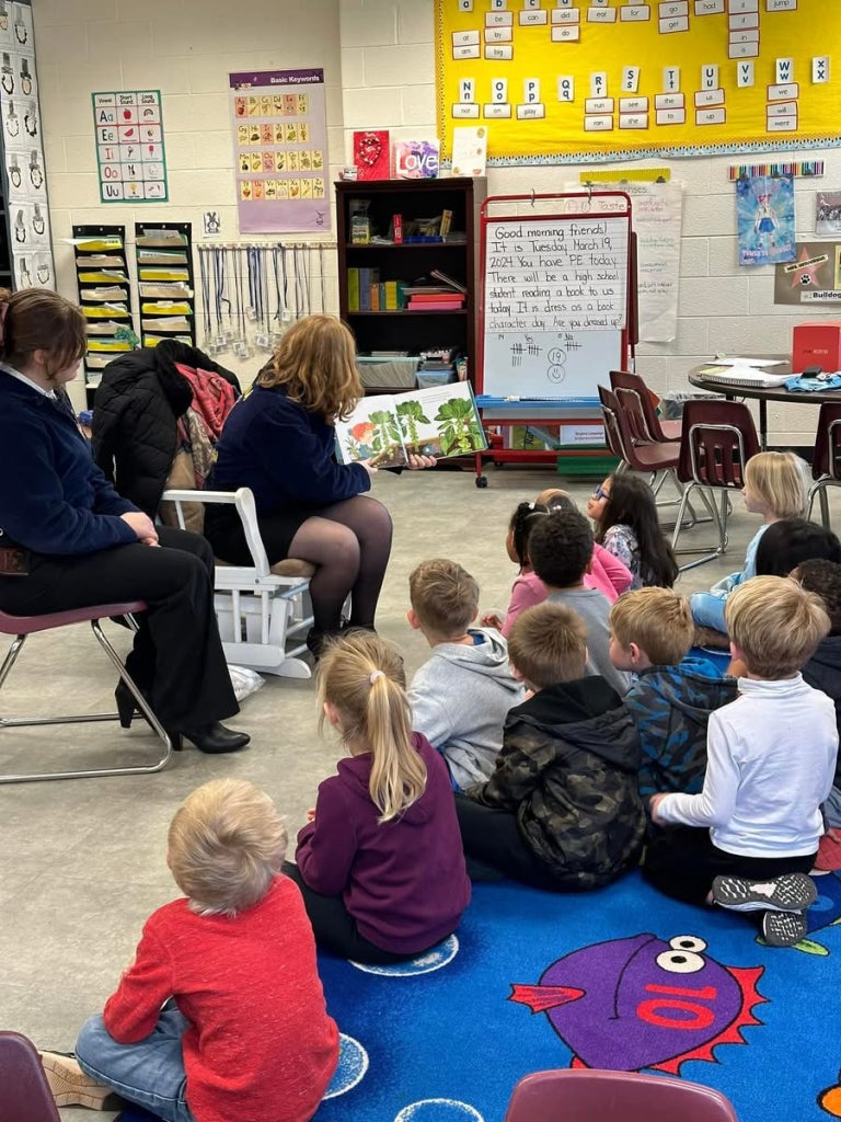 FFA members read to students about agricultural footwear.