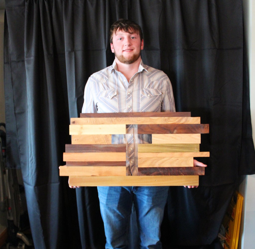 Trevor Tague displays the project he donated to the cancer auction. He played a key role throughout the event by serving food, assisting with load‑out and answering questions. This showcased his strong commitment to the Carroll County community. Photo Credit: Emma Owen.