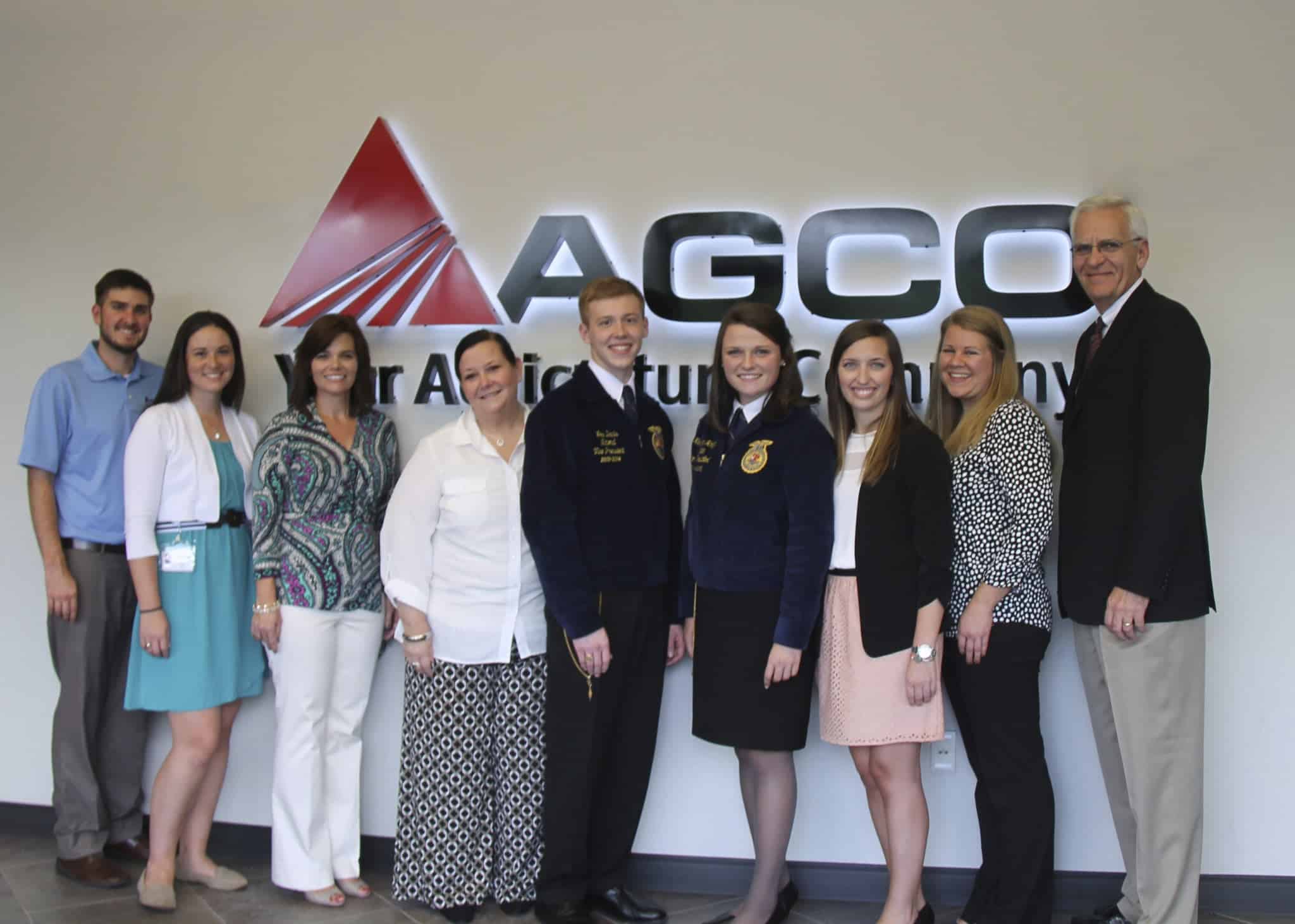 Community leaders take a picture with two Georgia FFA state officers.
