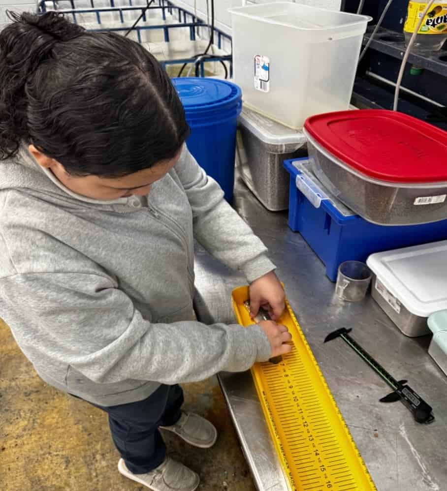 Students participate in hands-on learning opportunities through the program’s “hatchery to habitat” strategy.