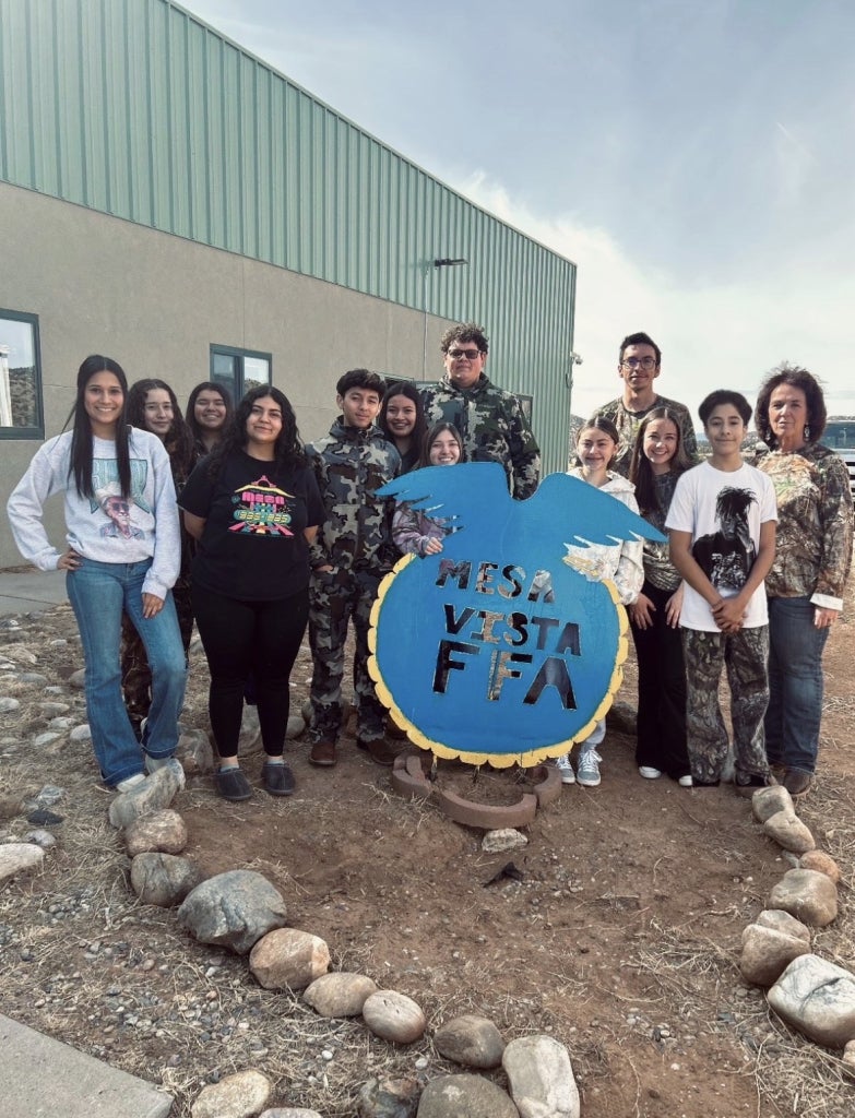 Mesa Vista FFA members pose with their Mesa Vista FFA sign.