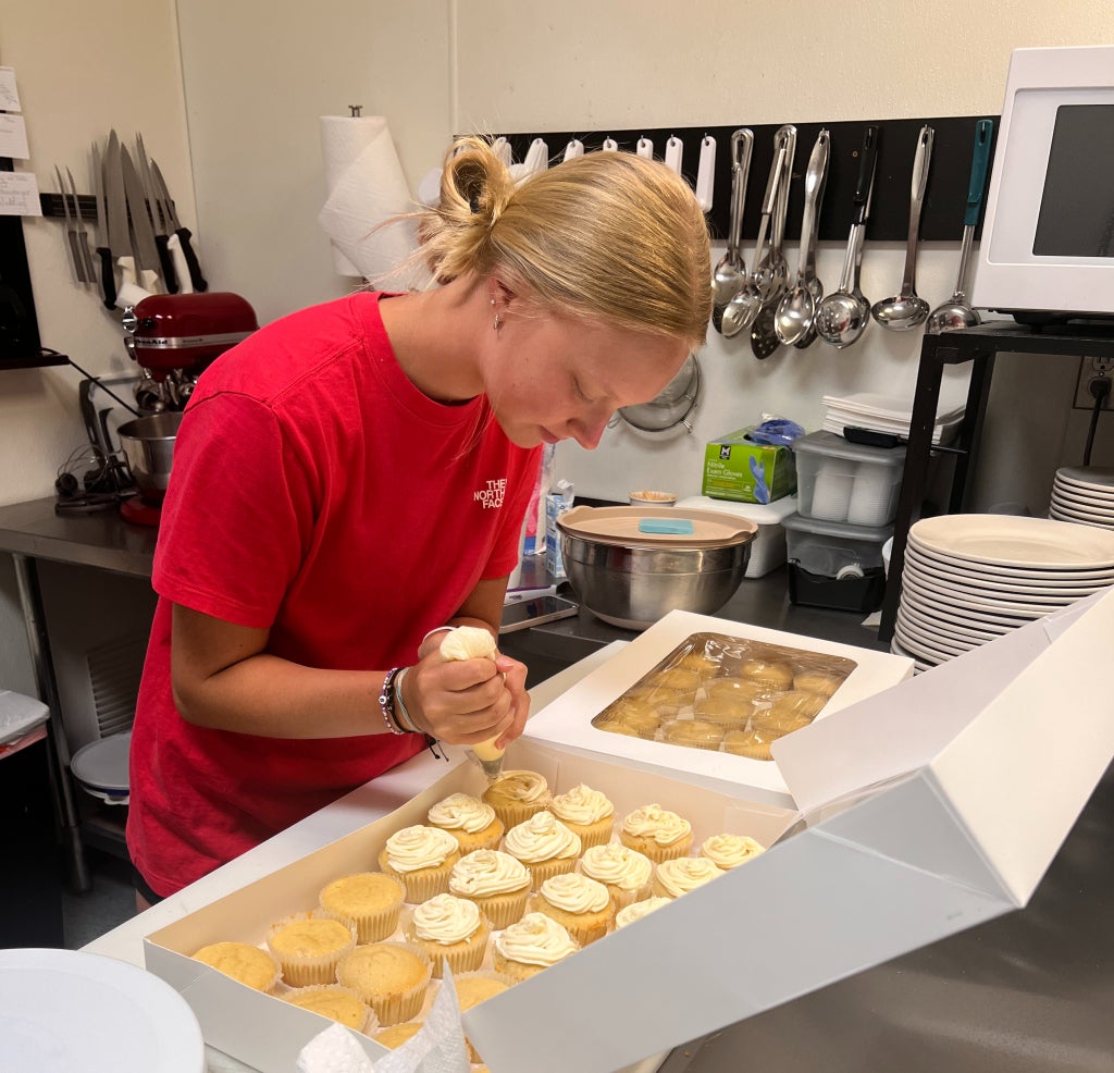 Saige Horine works on her baking SAE project, preparing homemade goods. She recently donated items to the Carroll County Help Cancer Fund Auction, using her skills to give back to the community.