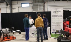 FFA members talk to an exhibitor from Midwest Drones.