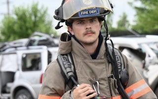 Nelson Milner wearing his firefighter gear at Cadet Explorer Fire School.