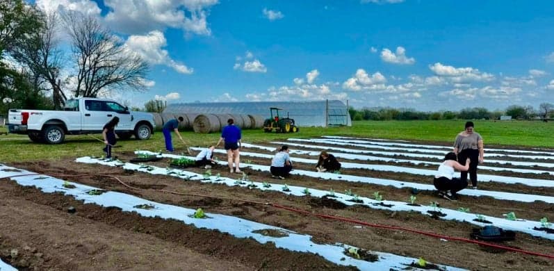 Bluejacket FFA members working on their 10-acre farm. 