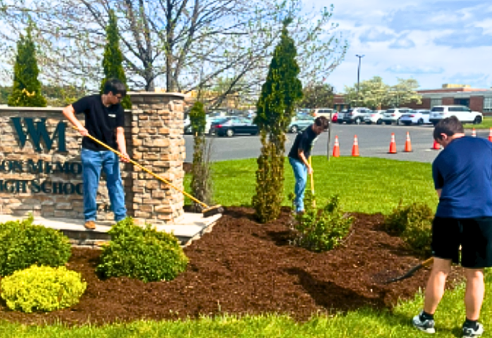 Wilson Memorial Agriculture students mulch and landscape garden areas around the school, a service activity conducted each year to aid in the beautification of the campus.
