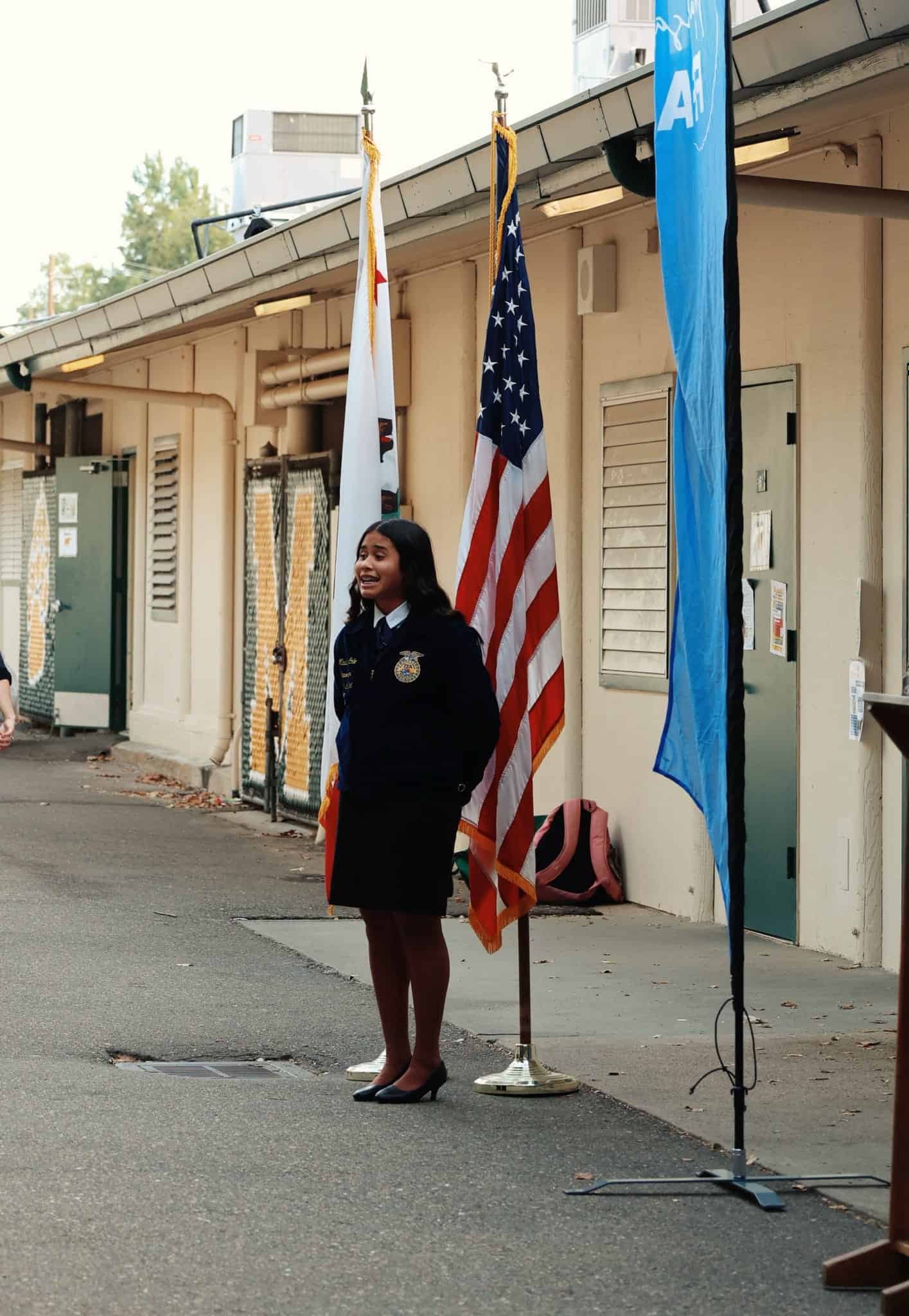 Maddie Cole saying Opening and Closing Ceremonies at a chapter meeting. Picture taken by Kensley Silva.