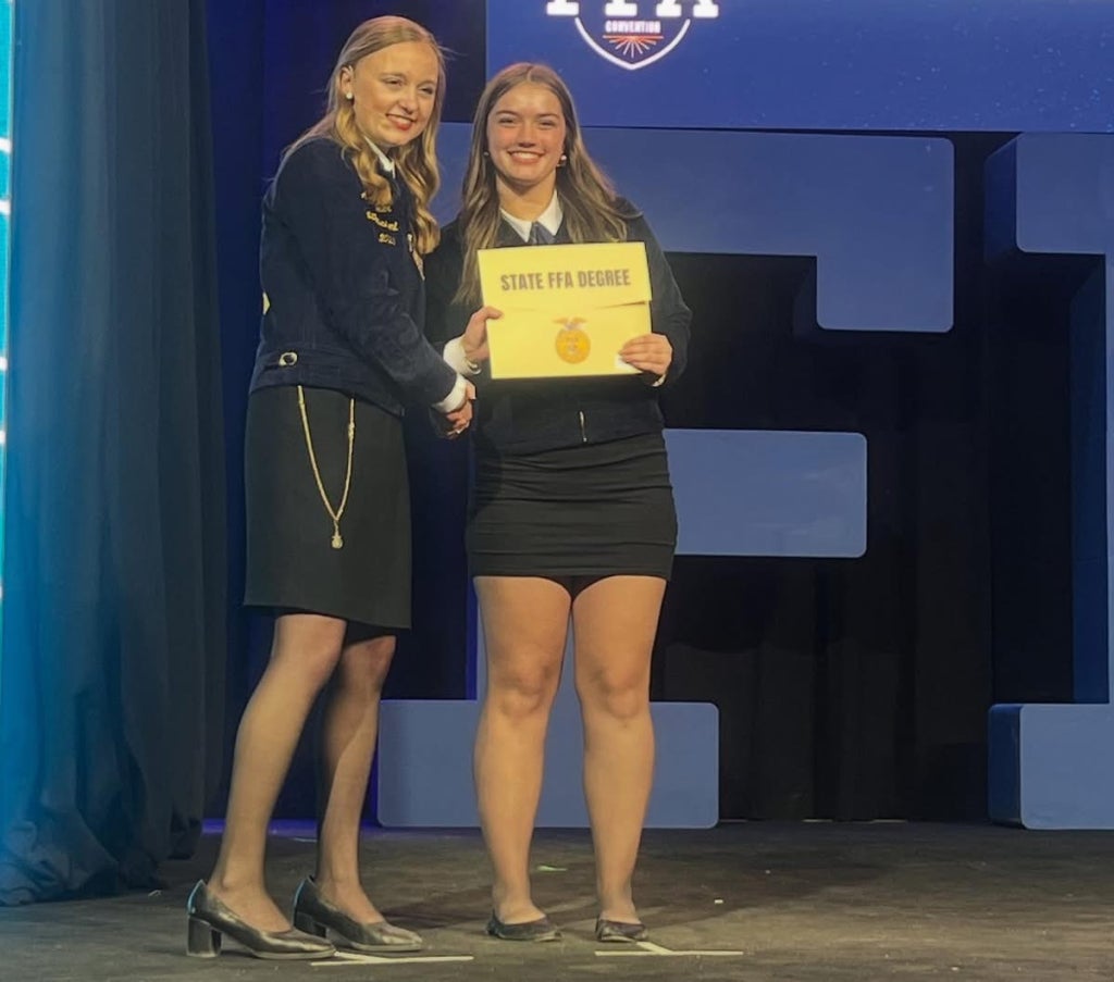 Garreston receiving her State FFA Degree from Former Ohio FFA President Anna Moeller.
