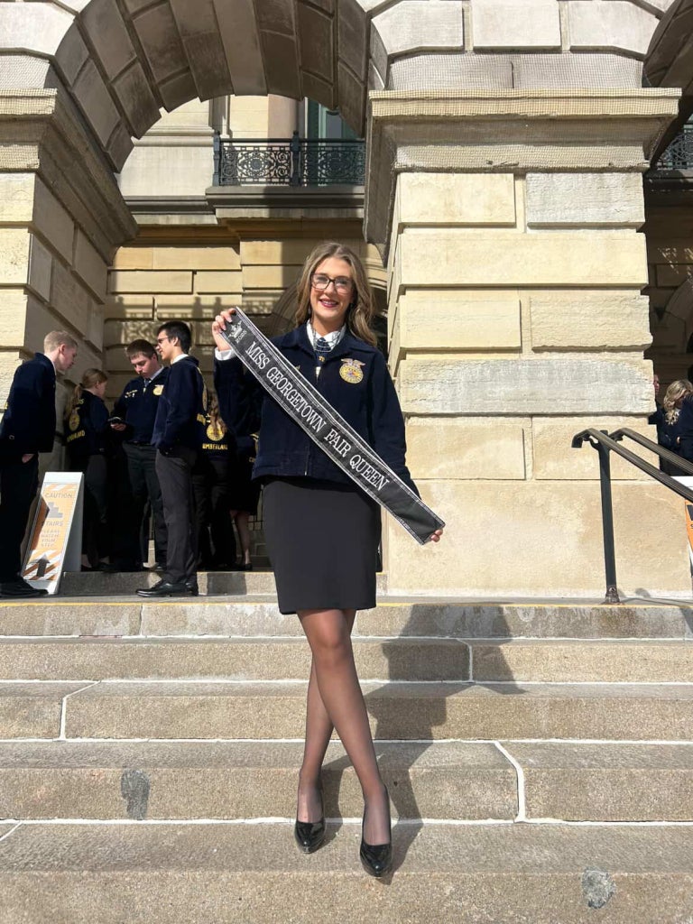 Fourez poses with her fair queen sash in front of the Illinois State Capitol for Ag Legislative Day.