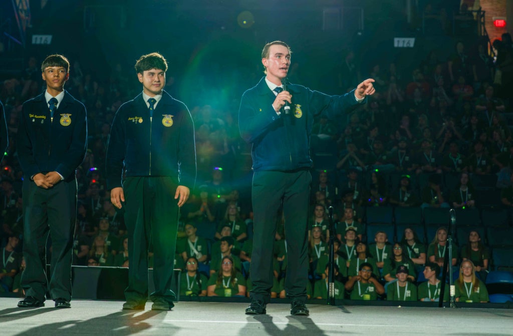 William Scheurer presenting the first paragraph of the FFA Creed in English. Photo taken by California FFA Press Corp. member Ryan Tolmosoff of the Merced-Stone Ridge Christian FFA Chapter.