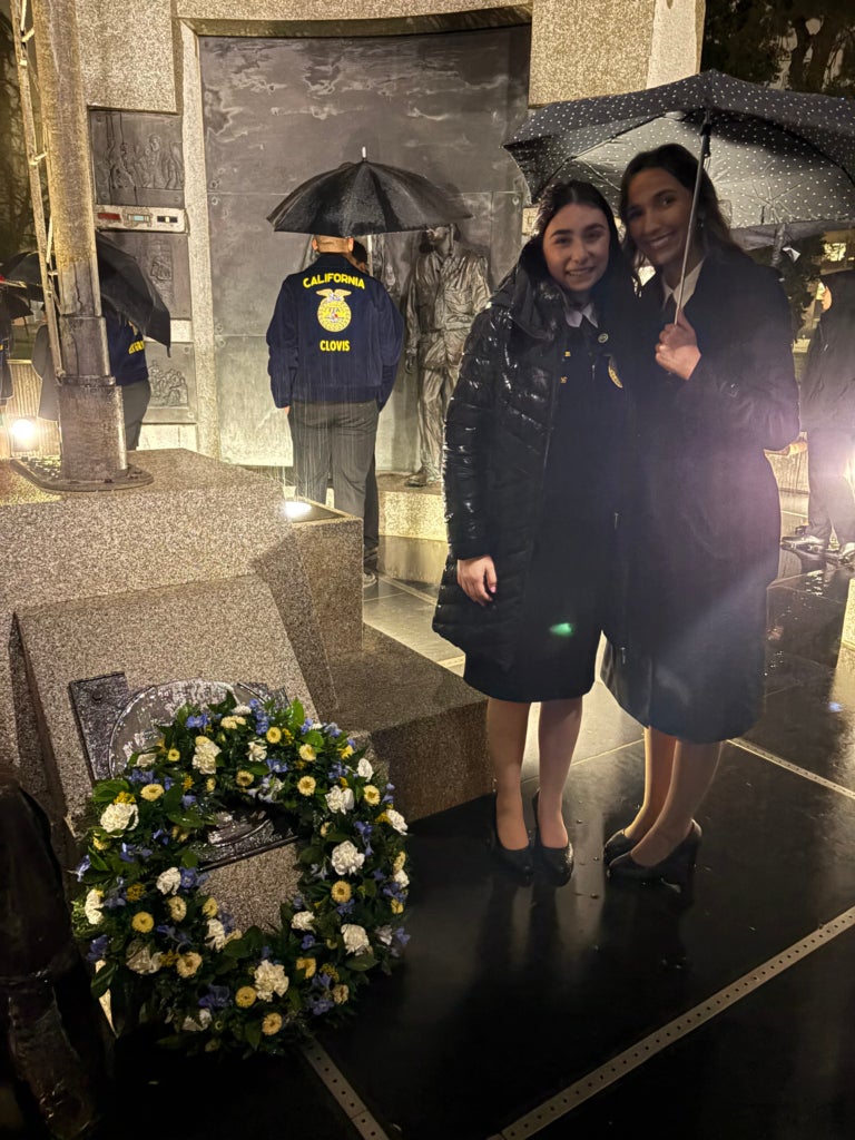 Dakota Graham and Faith Escoto, Sacramento Leadership Experience attendees and Grass Valley - Bear River FFA members, lay the wreath at the Vietnam War memorial center in Sacramento, Calif.
