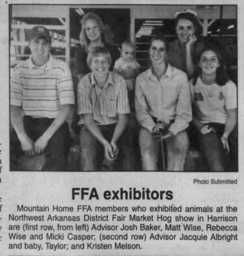 Matthew Wise next to his advisor, Josh Baker, while showing at the district fair in 2004.