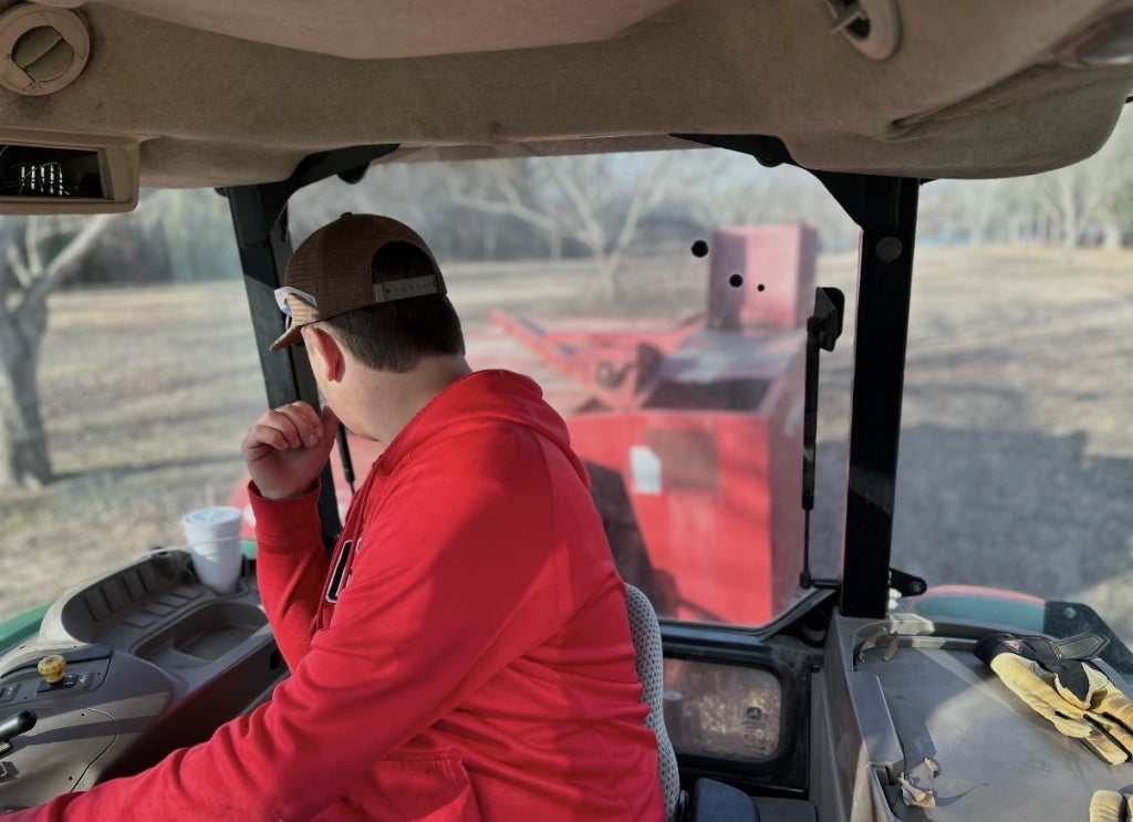 Smoak works on his Supervised Agricultural Experience in fruit and nut production.