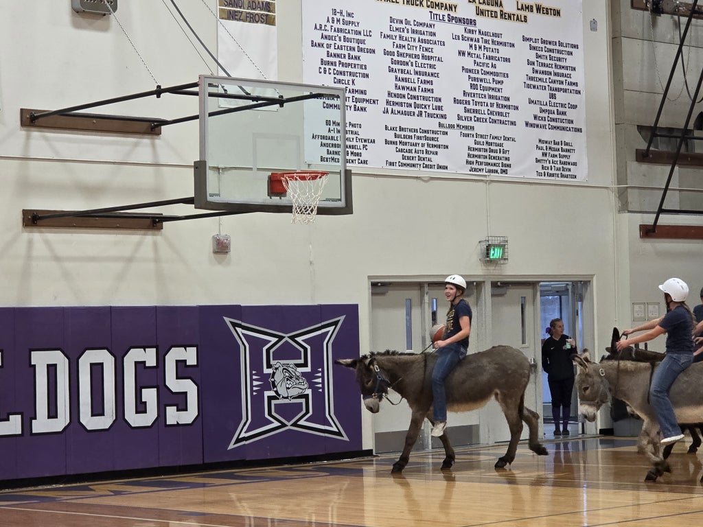 Hermiston FFA holds a donkey basketball game event.
