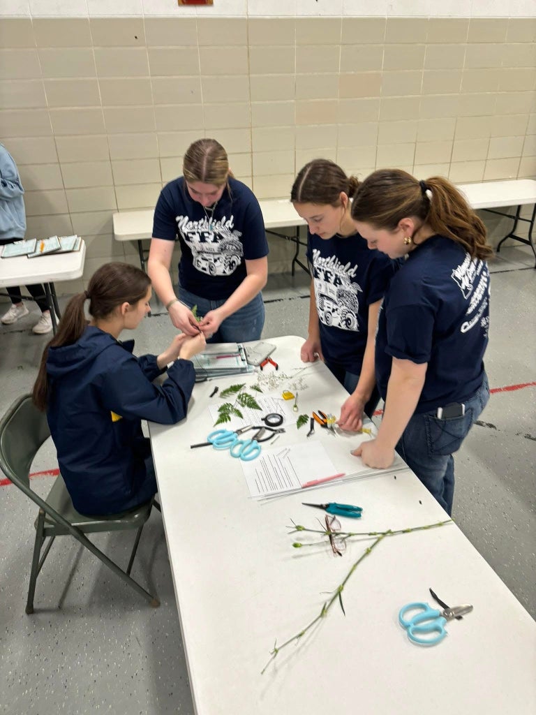 Kuennen and her teammates competing in the floriculture career development event.